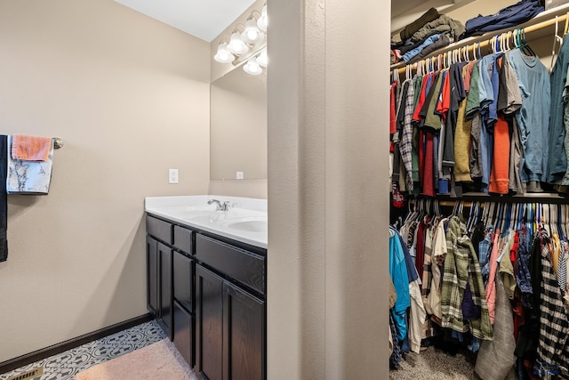 bathroom featuring vanity and tile patterned flooring