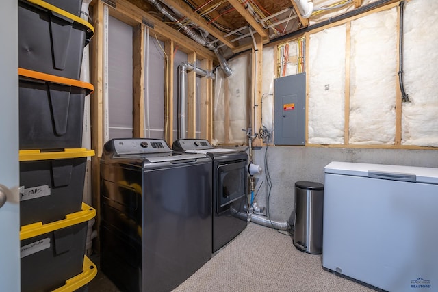 laundry room featuring independent washer and dryer, electric panel, and light colored carpet