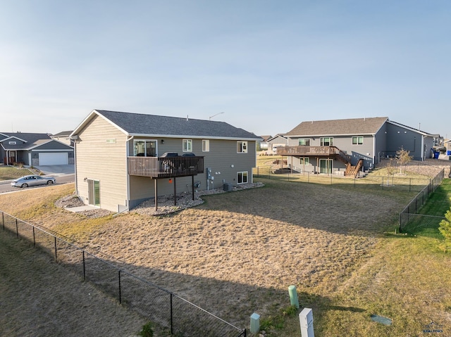 rear view of property with a wooden deck