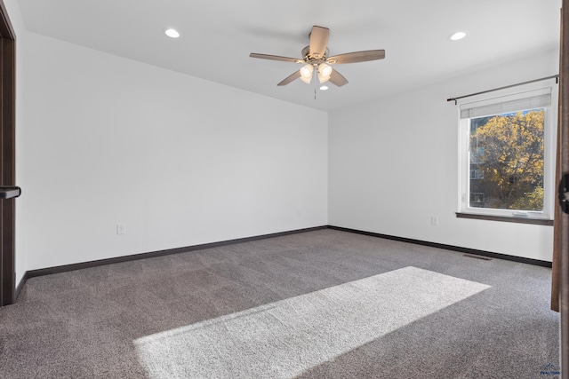 unfurnished room with carpet and ceiling fan