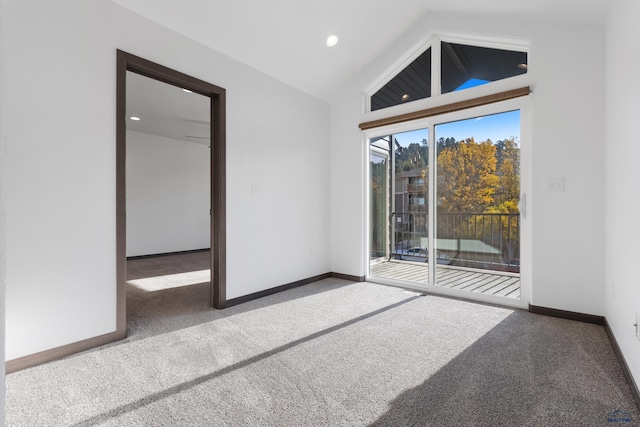 empty room with carpet and lofted ceiling