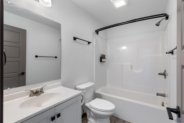 full bathroom with hardwood / wood-style flooring, vanity, toilet, and tub / shower combination