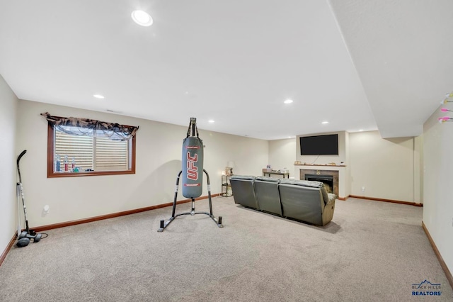 exercise room with light colored carpet