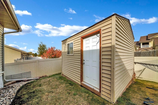 view of outdoor structure with a lawn