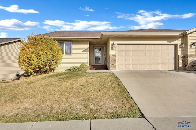 ranch-style home featuring a front yard and a garage