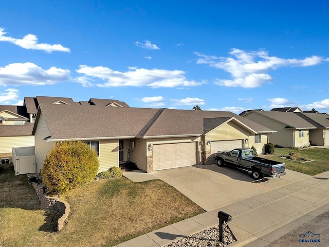 single story home with a front yard and a garage