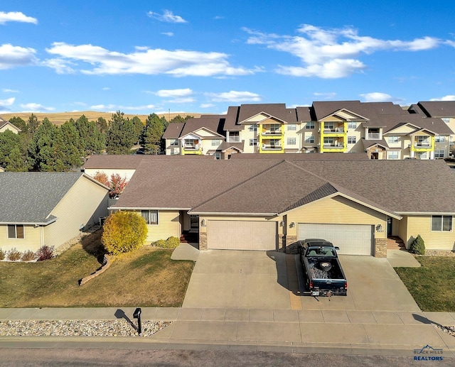 single story home with a front yard and a garage