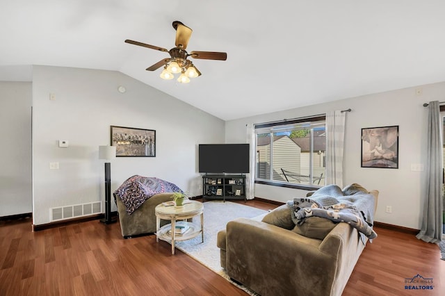 living room featuring ceiling fan, lofted ceiling, and hardwood / wood-style floors