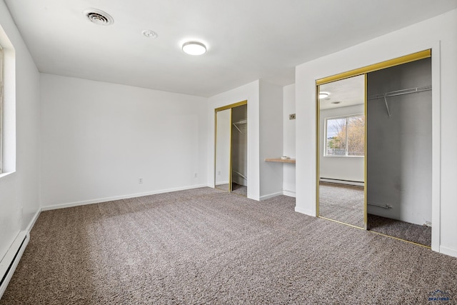 unfurnished bedroom featuring baseboard heating and dark colored carpet