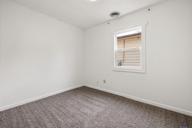 empty room with carpet flooring