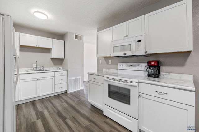 kitchen featuring white appliances, white cabinets, sink, and dark hardwood / wood-style flooring