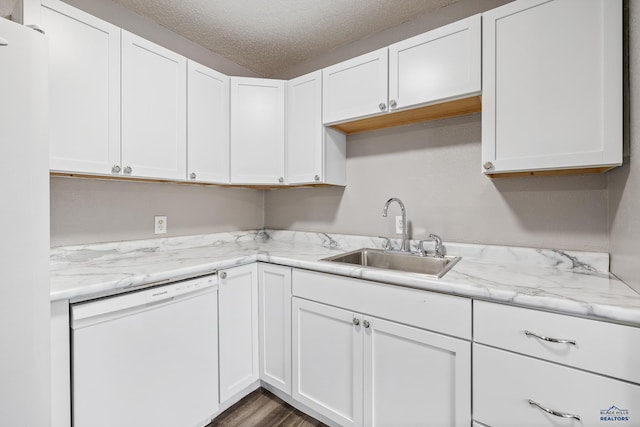 kitchen with white cabinetry, a textured ceiling, white dishwasher, dark hardwood / wood-style floors, and sink