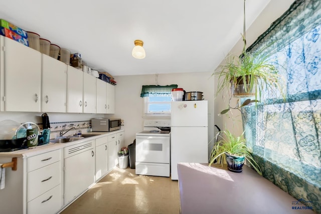 1922 Ivy Ave, Rapid City, SD 57701 - kitchen with sink, white cabinetry, and white appliances