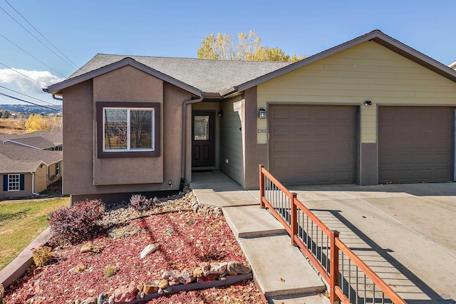 single story home featuring a garage