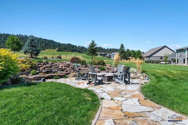 view of yard with a patio area and a fire pit