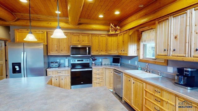 kitchen with recessed lighting, a sink, wood ceiling, light countertops, and appliances with stainless steel finishes