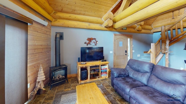 living area with wooden ceiling, stairway, log walls, stone finish flooring, and a wood stove