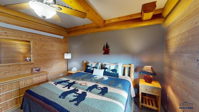 bedroom featuring wood walls, beamed ceiling, and a ceiling fan