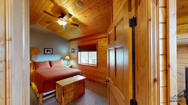 carpeted bedroom with wood ceiling, vaulted ceiling, and wooden walls