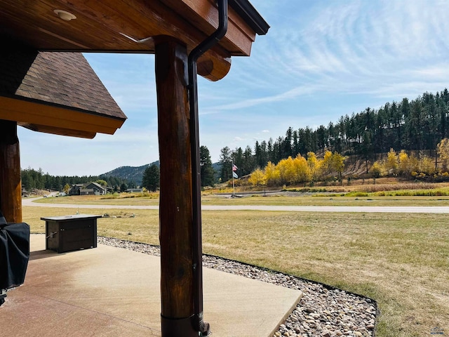 view of patio / terrace featuring a mountain view