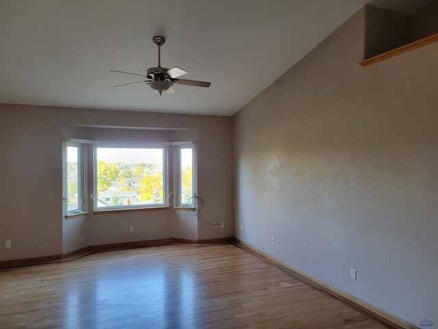 unfurnished room with light wood-type flooring and ceiling fan