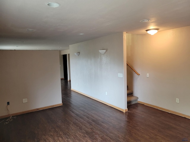 empty room featuring dark wood-type flooring