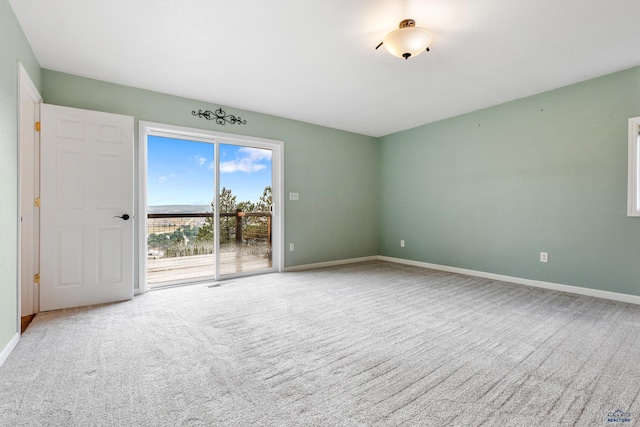 empty room featuring light carpet