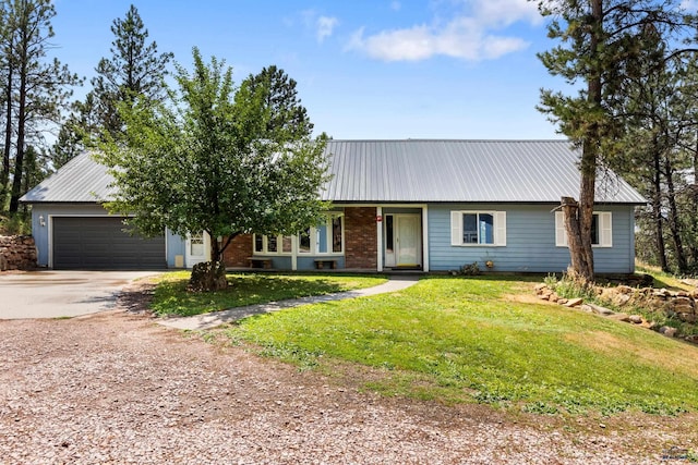 single story home with a front yard and a garage