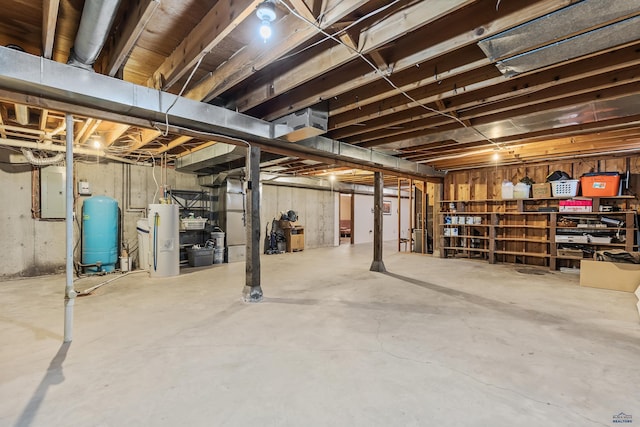 basement with electric panel and gas water heater