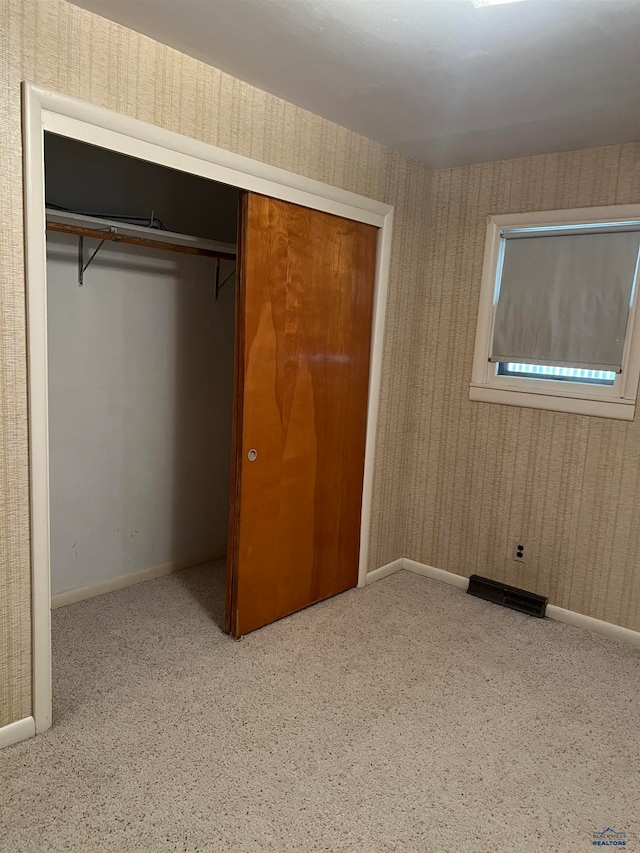 unfurnished bedroom featuring a closet