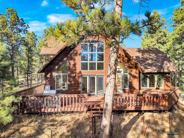 rear view of house with a deck