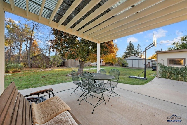 view of patio featuring a shed