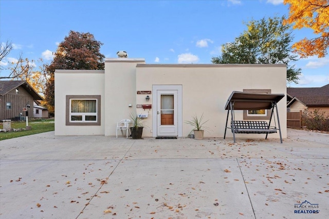 view of front of house with a patio area