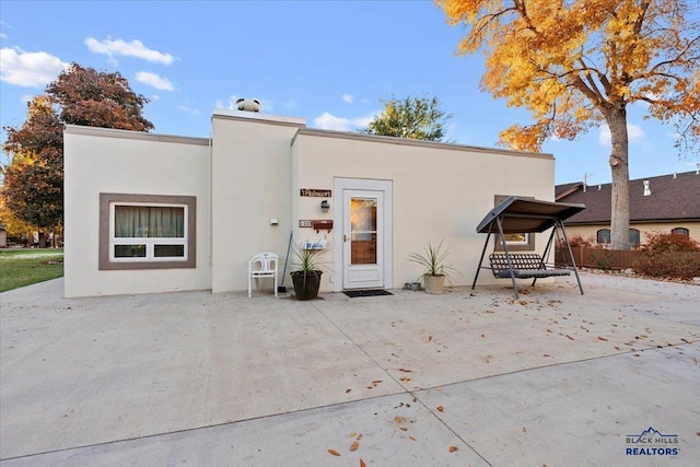 rear view of house with a patio