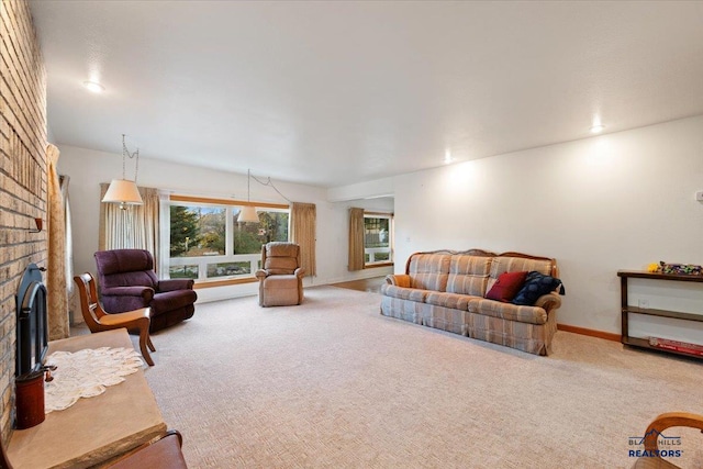 carpeted living room featuring a brick fireplace