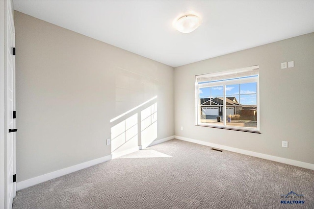 unfurnished room featuring carpet flooring