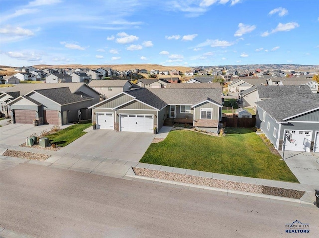 single story home featuring a garage and a front yard