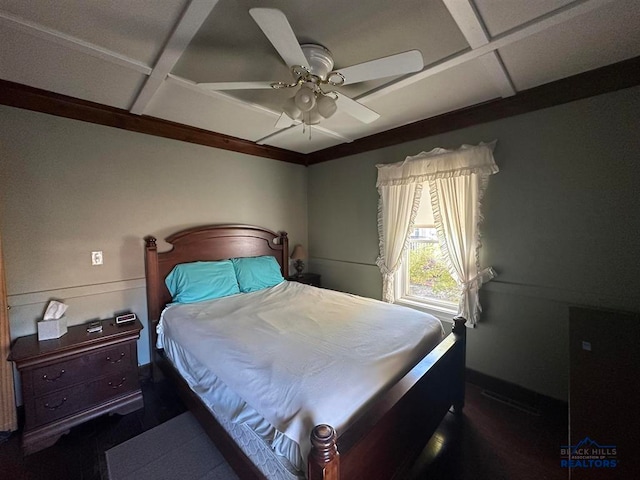 bedroom with coffered ceiling and ceiling fan