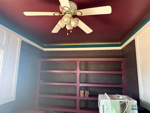 interior details featuring ornamental molding and ceiling fan