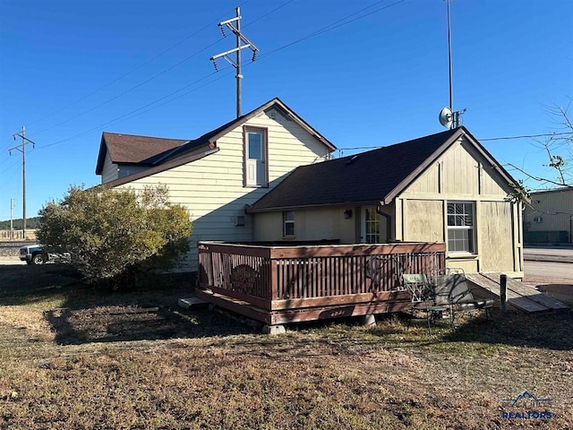 back of property with a deck