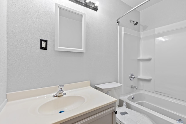 full bathroom featuring toilet, vanity, and washtub / shower combination