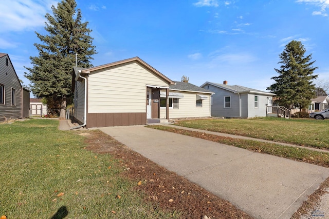 ranch-style home with a front lawn