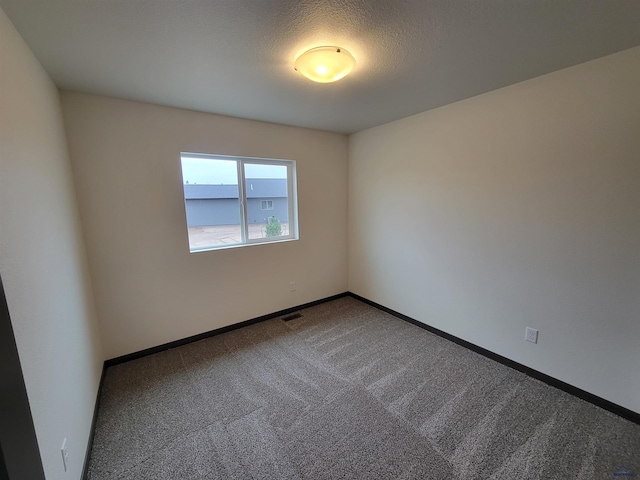 1118 Cobalt Dr, Rapid City, SD 57701 - carpeted spare room with a textured ceiling