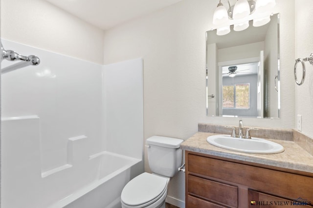 full bathroom featuring ceiling fan, vanity, toilet, and shower / tub combination