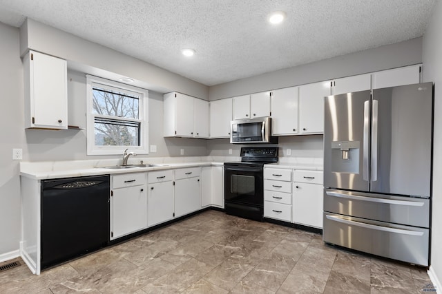 kitchen with white cabinets, a textured ceiling, black appliances, and sink