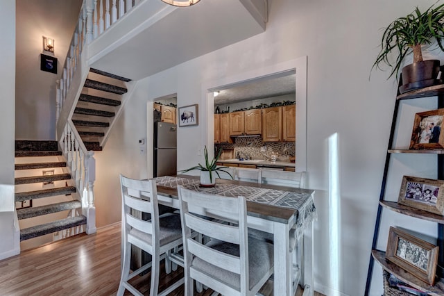 dining space featuring light hardwood / wood-style flooring