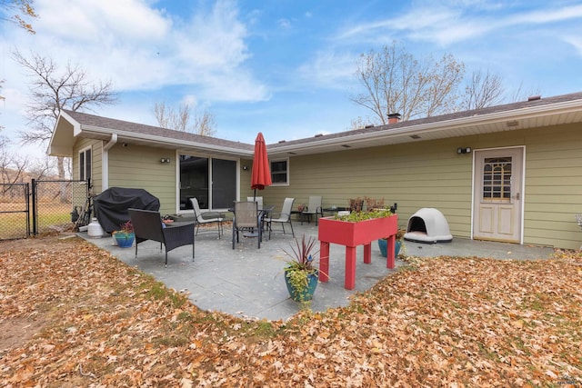 rear view of house featuring a patio