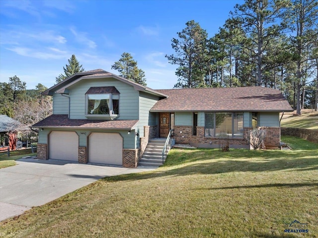 tri-level home with a front yard and a garage