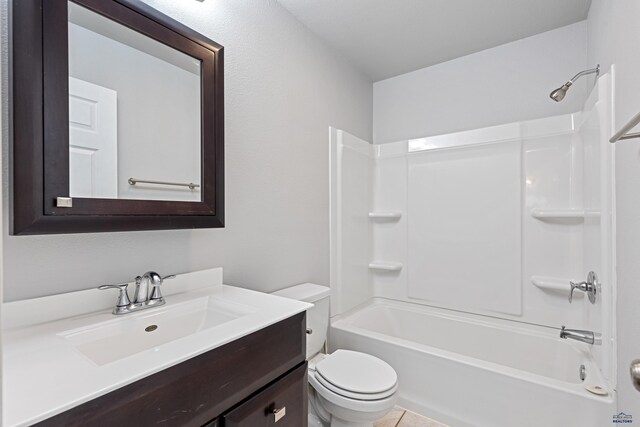 full bathroom featuring shower / tub combination, vanity, toilet, and tile patterned floors