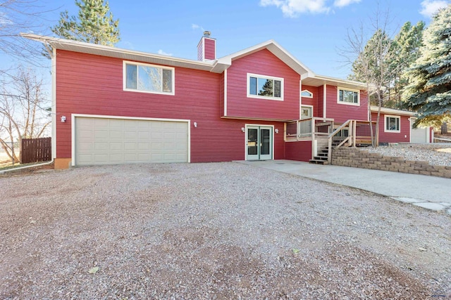 raised ranch featuring a garage